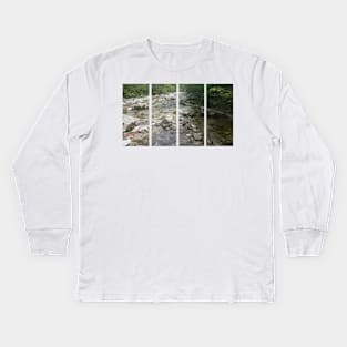 A static shot of the clear water of a mountain stream between rocks and stones; beautiful nature in a sunny day; no people around Kids Long Sleeve T-Shirt